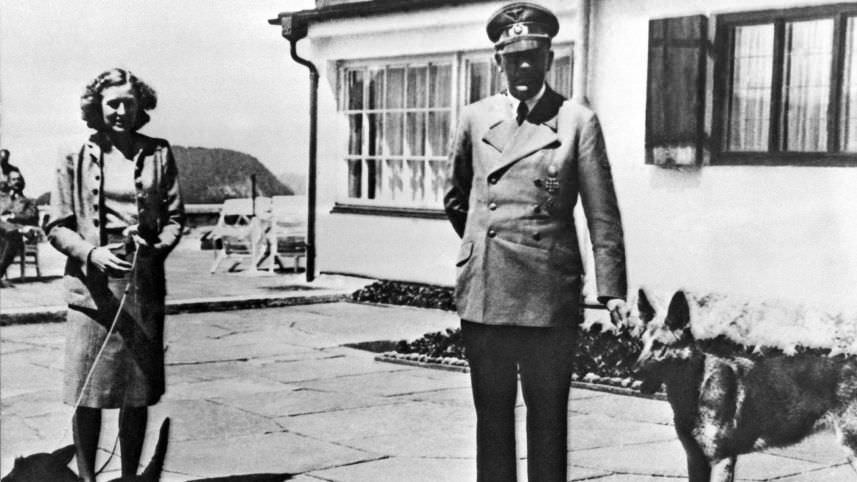 Undated photo of Adolf Hitler and his then girlfriend Eva Braun posing on the terrace of the Berghof, Berchtesgeden, Germany.AP
