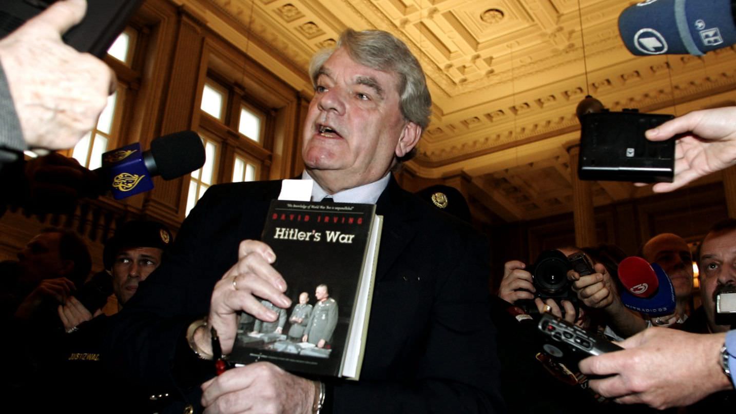 Right-wing British historian David Irving holds his book "Hitler's War" when arriving at a court in Vienna, on Feb. 20, 2006. Credit: Hans Punz, AP 